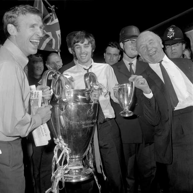 Manchester United's Pat Crerand, George Best and manager Matt Busby celebrate with the European Cup