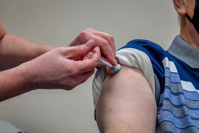 Someone receiving the jab