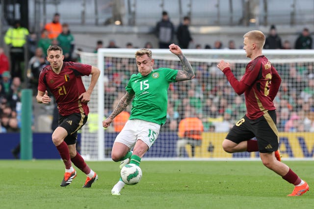 Republic of Ireland’s Sammie Szmodics (centre) in action with Belgium's Timothy Castagne (left) and Arthur Vermeeren