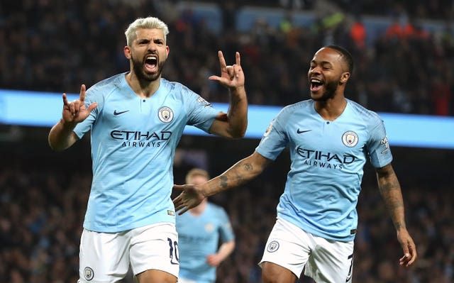 Sergio Aguero, left, celebrates with Raheem Sterling