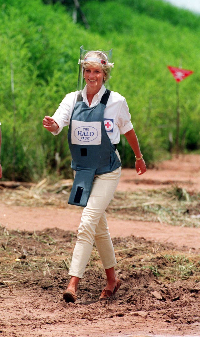 Diana, Princess of Wales walking through a minefield during a visit to Angola in January 1997 to see the work of the British Red Cross (John Stillwell/PA)