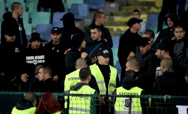 Stewards among Bulgaria fans in the stands in Sofia 