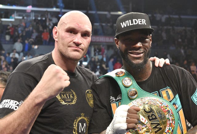 Tyson Fury, left, was unable to take Deontay Wilder's WBC heavyweight title after their meeting last December was scored a draw (Lionel Hahn/PA)