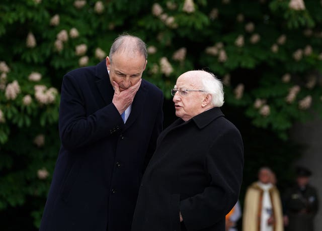 Taoiseach Micheal Martin (left) in conversation with President Michael D Higgins
