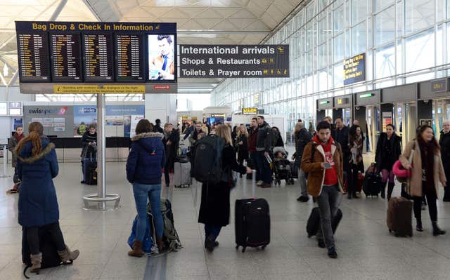 Checking in at the airport can lead to unexpected charges (Joe Giddens/PA)