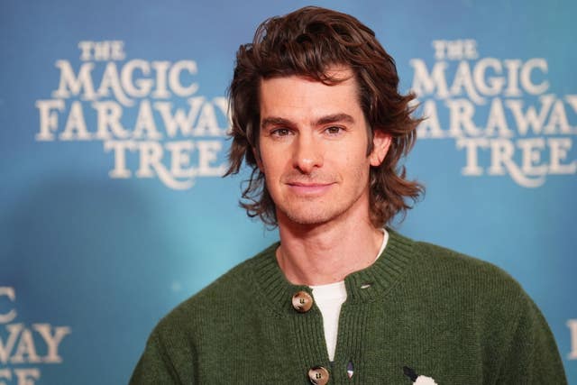 Andrew Garfield wearing a green cardigan with palm trees at The Magic Faraway Tree special screening