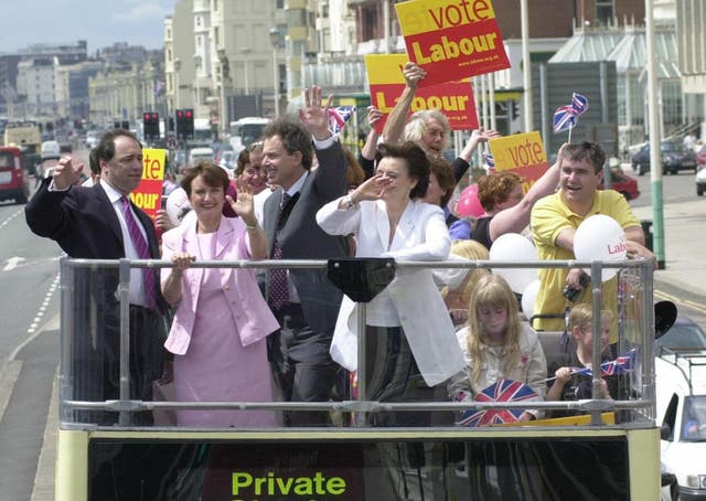 Prime Minister Tony Blair (centre left), alongside his wife Cherie Blair (centre right), takes an opentop bus tour through Brighton, East Sussex with Tessa Jowell in 2001 (Toby Melville/PA)