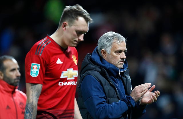 Phil Jones, left, and Jose Mourinho