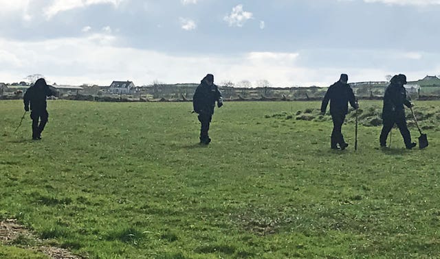 Police search the airfield in Ballyhalbert, Co Down