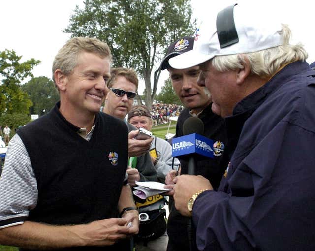 European Ryder Cup players Padraig Harrington (centre) and Colin Montgomerie (left) are interviewed on American television after defeating Woods and Mickelson
