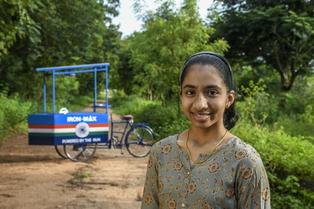Vinisha Umashankar with the solar-powered ironing cart she designed
