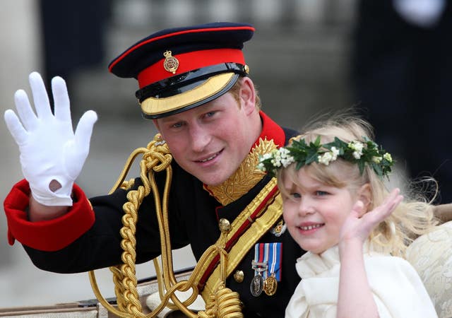 Prince Harry waves to the crowds with Lady Louise Windsor in the procession after William and Kate's wedding (Steve Parsons/PA)