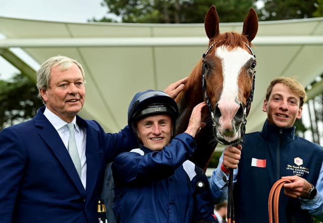 William Haggas and Tom Marquand with Economics after winning the Irish Champion Stakes