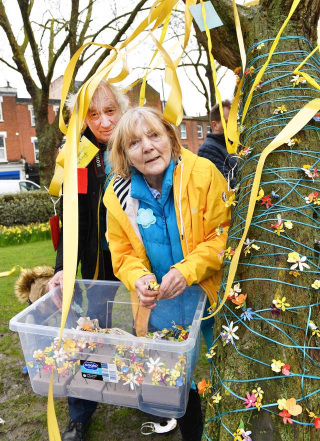 John and Barbara Ratcliffe, the parents of Richard Ratcliffe, help decorate a tree in Fortune Green in West Hampstead on the anniversary Nazanin Zaghari-Ratcliffe’s detention