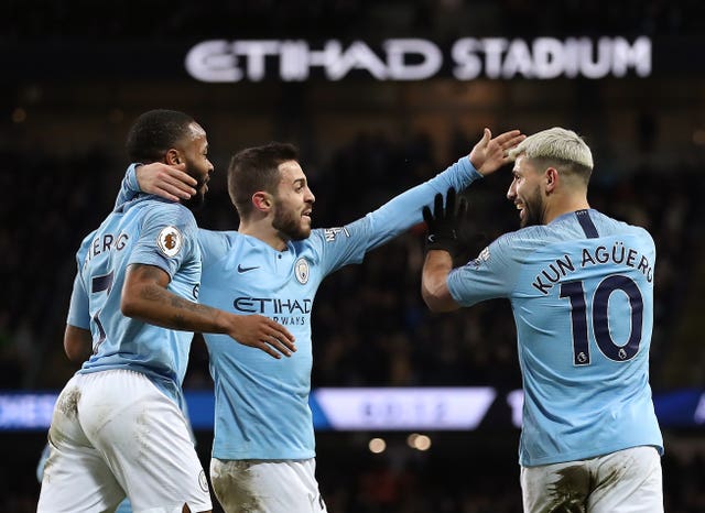 Manchester City celebrate a goal against Arsenal