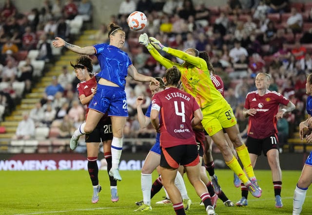Lucy Bronze heads the ball into the net
