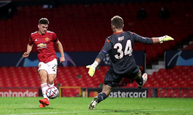 Daniel James, left, scores United’s fourth goal