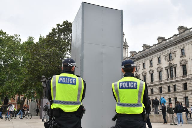 Sir Winston Churchill's statue in Parliament Square has been protected to save it from being damaged (Dominic Lipinski/PA)