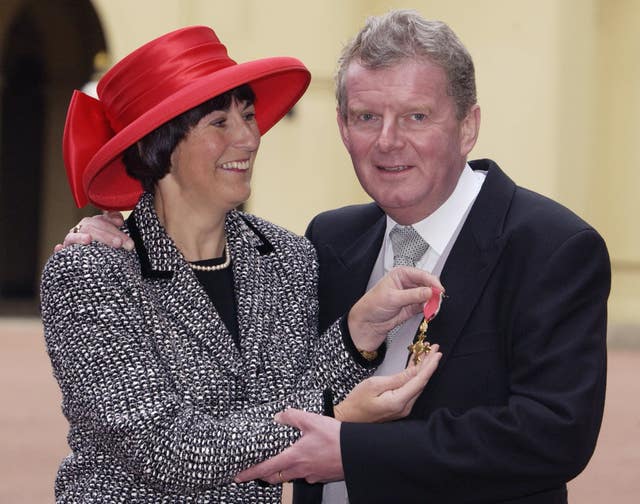 Motson with his wife Annie, receiving an OBE in 2001