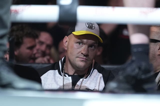 Tyson Fury watches his half-brother Tommy Fury's fight with Eddie Hall from ringside