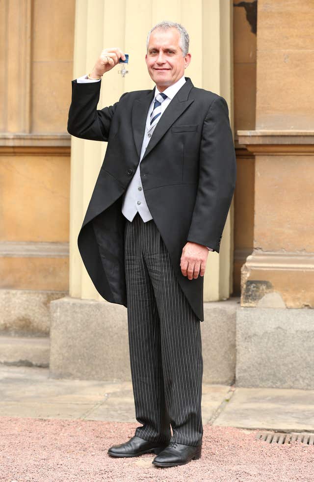 Dominic Troulan after being awarded the George Cross (Jonathan Brady/PA)
