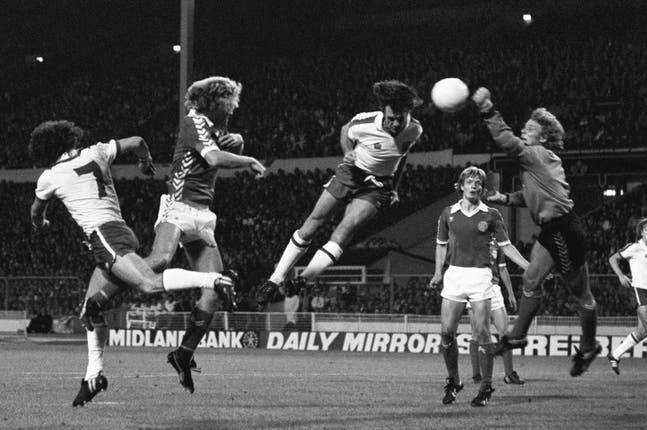 Dave Watson, pictured heading the ball in a match between England and Denmark, is suspected of having the progressive brain disease CTE