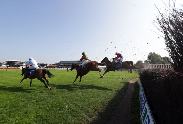 Kitty’s Light and Jack Tudor (right) make ground en route to victory at Warwick