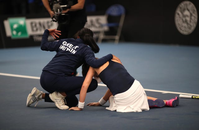 Johanna Konta collapsed after victory and was helped by Anne Keothavong during the Fed Cup clash with Serbia