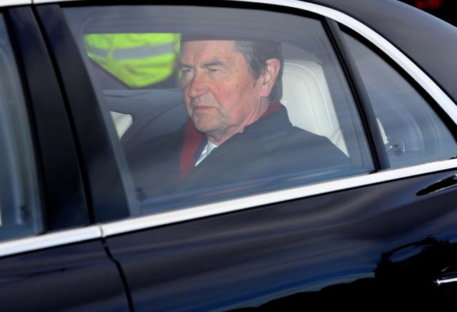 Vice Admiral Sir Tim Laurence also seen arriving at the palace for the Christmas lunch. Aaron Chown/PA Wire