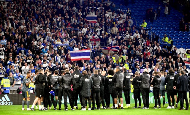 Leicester players, staff and fans mark their victory together