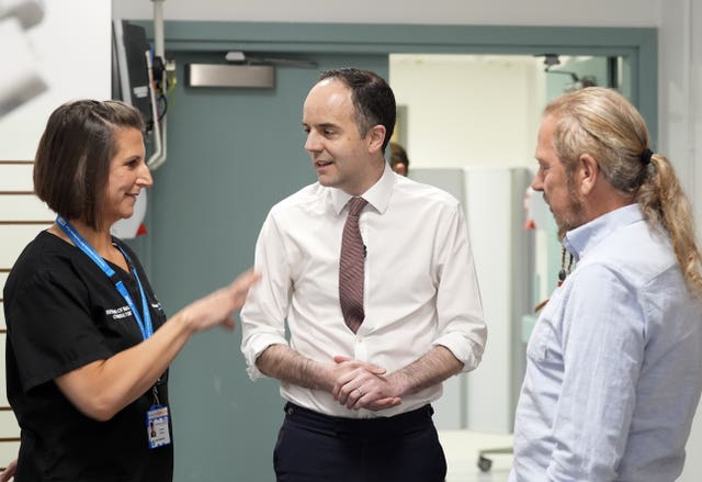 Health Secretary James Murray, centre