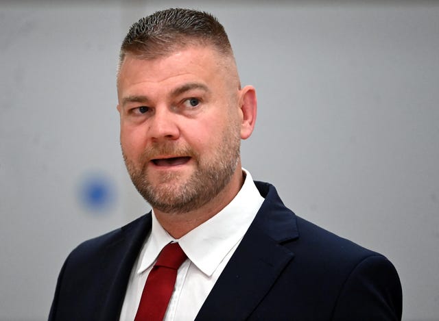 Head and shoulders photo of Colin McGrath speaking