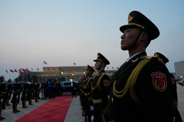 Chinese honour guards prepare for the arrival of Prime Minister Sir Keir Starmer