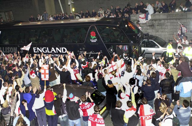 England's bus is mobbed by fans at Heathrow Airport