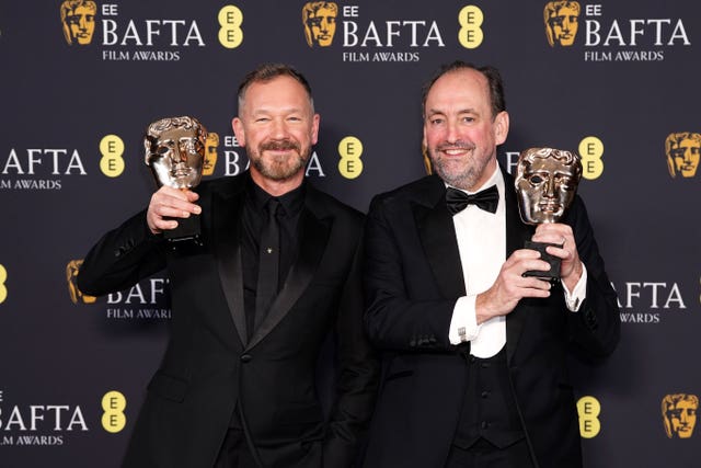 Nathan Crowley and Lee Sandales with their awards for best production design at the 2025 Baftas on February 16