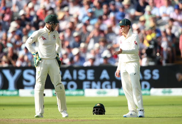 Steve Smith, right, offers his input to captain Tim Paine