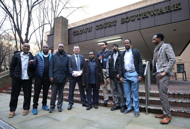 James Farrar, fourth left, with Uber drivers outside Southwark Crown Court