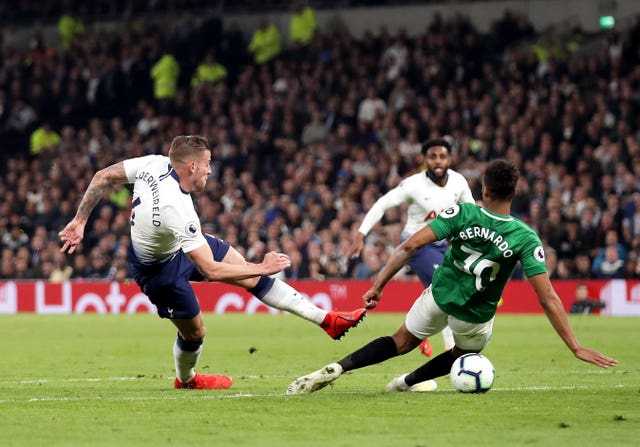 Toby Alderweireld, left, sends an off-balance shot against the post