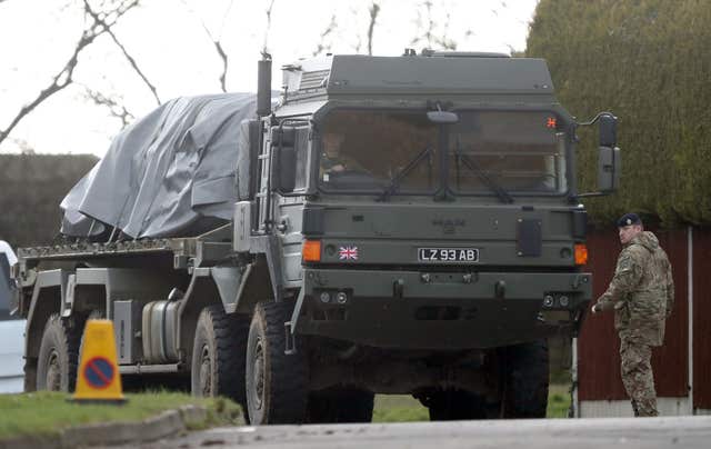 Large military vehicles and men in regular Army uniforms joined Metropolitan Police officers inside the cordon (Andrew Matthews/PA)