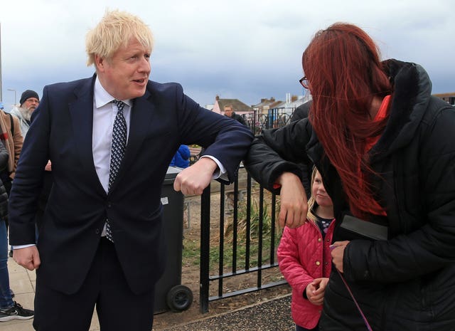 Prime Minister Boris Johnson greets members of the public with an elbow bump as he campaigns on behalf of Conservative Party candidate Jill Mortimer in Hartlepool