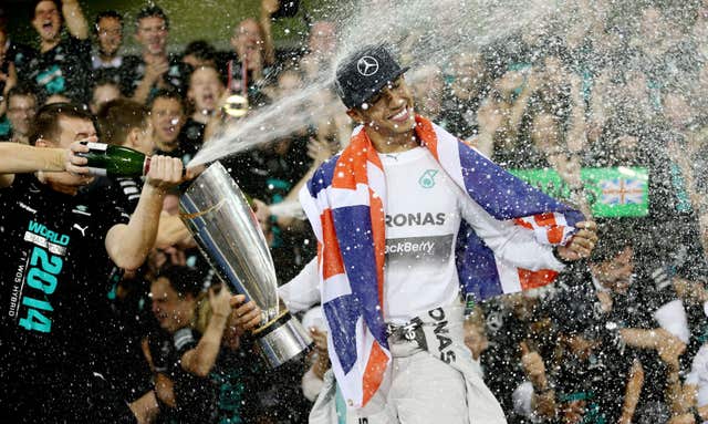 Hamilton celebrates becoming world champion again after victory in Abu Dhabi