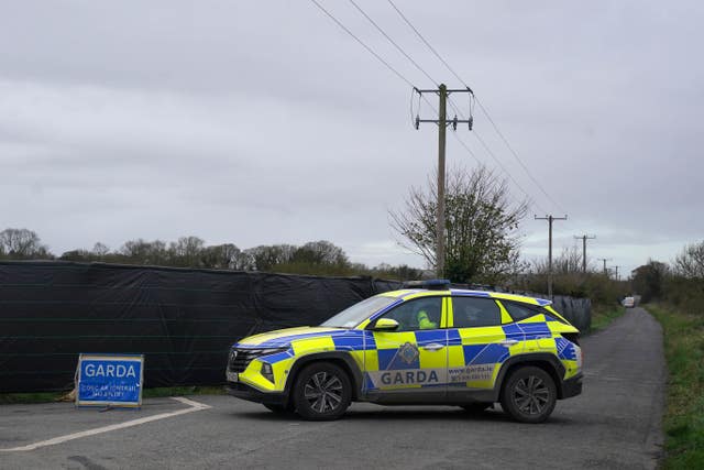 Gardai in a car at a search scene