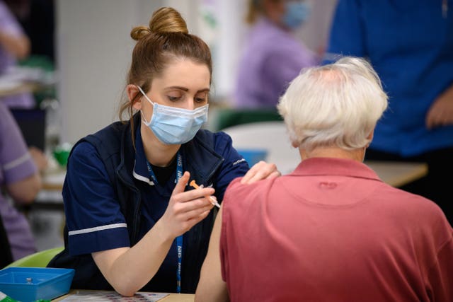 Millions of people have been vaccinated like this person at a centre in Stevenage