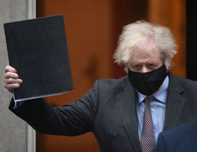 Prime Minister Boris Johnson leaves 10 Downing Street ahead of his address