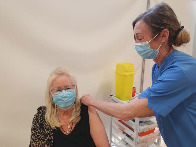 Aneira Thomas receiving the second dose of her Covid-19 jab at the mass vaccination centre at the Canolfan Gorseinon Centre