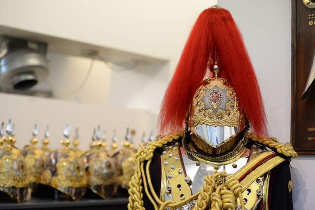 A uniform and helmets, also in the Full Dress store (Kirsty O’Connor/PA)