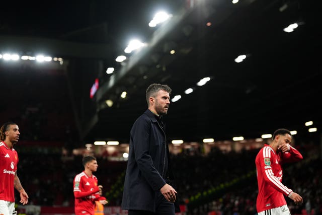 Manchester United manager Michael Carrick leaves the pitch after defeat to Brighton