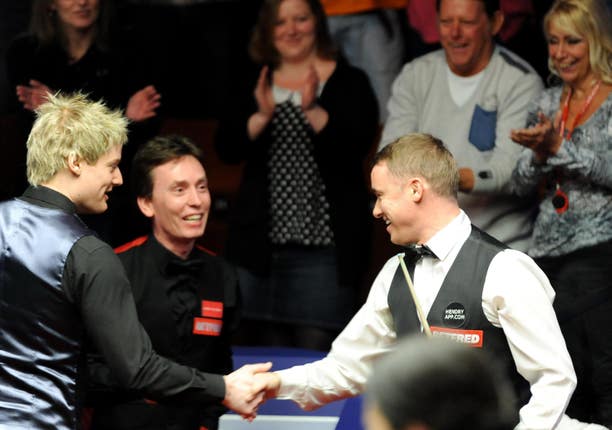Neil Robertson, left, and Ken Doherty, centre, paused their match to watch Stephen Hendry