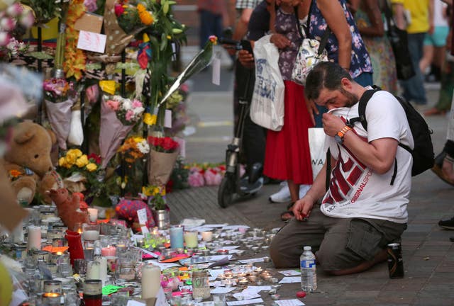 Tributes to the victims at Notting Hill Methodist Church near Grenfell Tower (Isabel Infantes/PA)