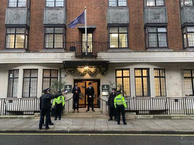 Police and hospital personnel outside King Edward VII’s Hospital in London
